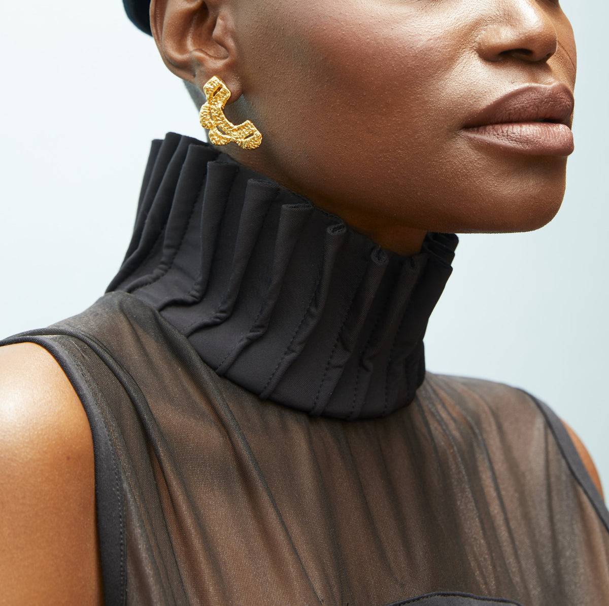 ancient inspired lace jewelry gold earrings on model designed by Alexandra Koumba