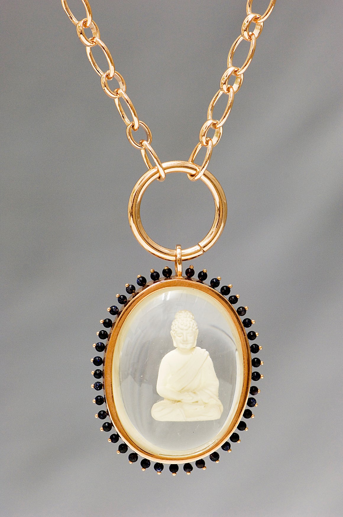 Buddha pendant with stones