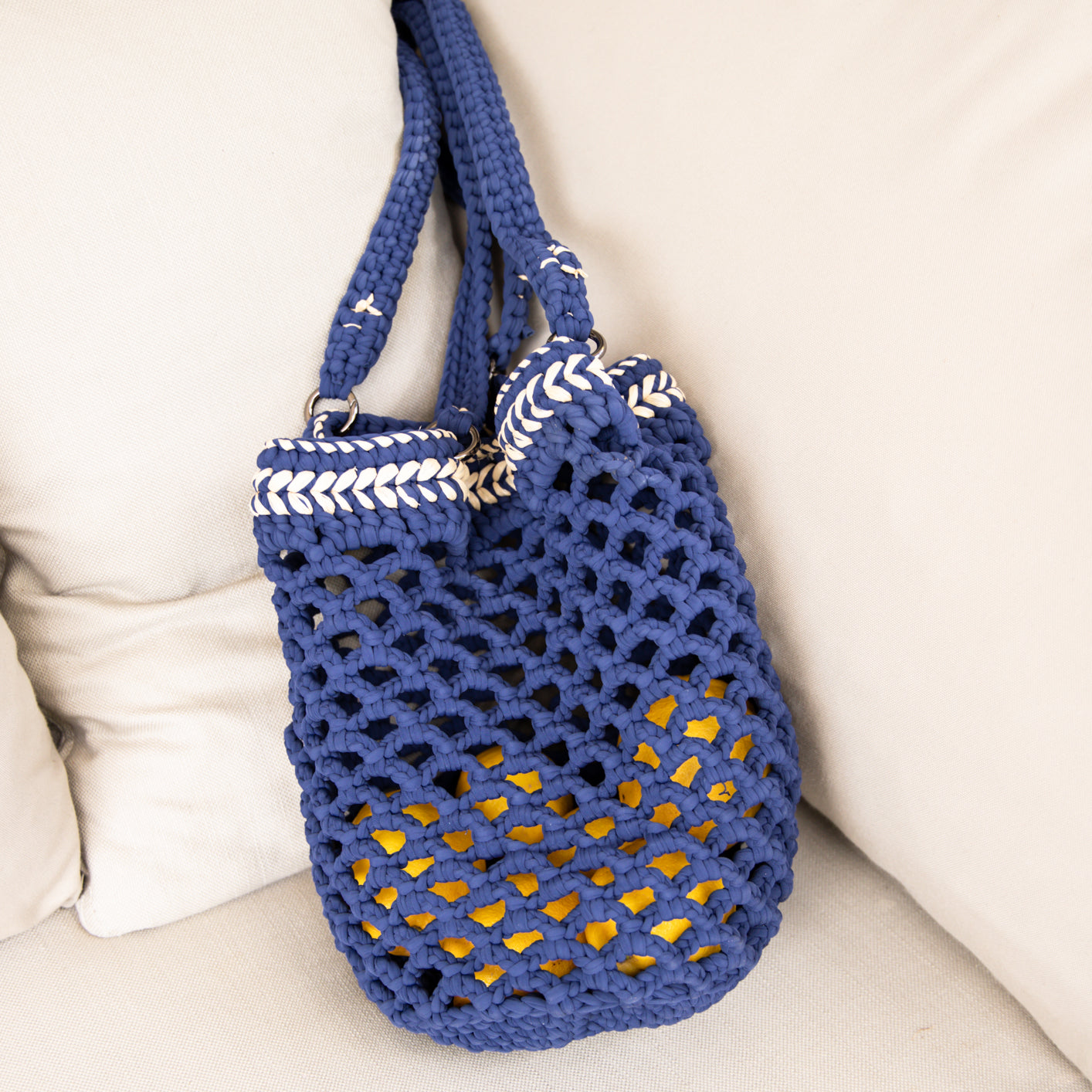 Fishnet raffia Daybag designed by alexandra koumba