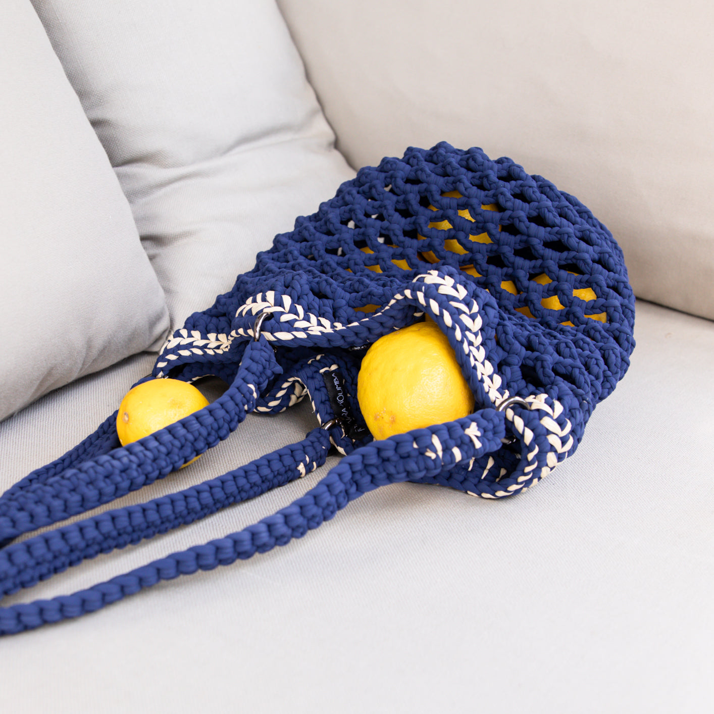 Fishnet raffia Daybag designed by alexandra koumba