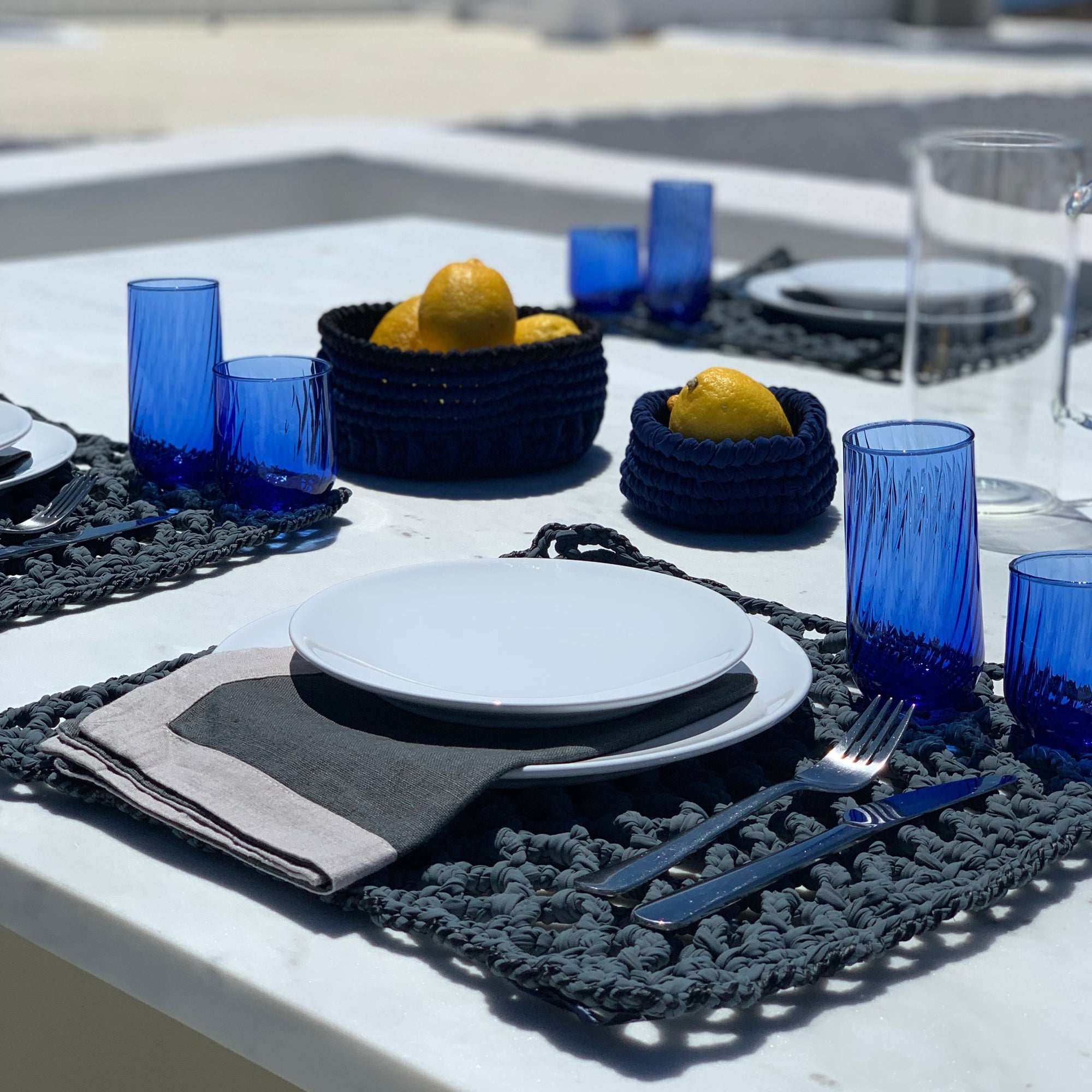 Raffia Square table set for 4 people designed by alexandra koumba