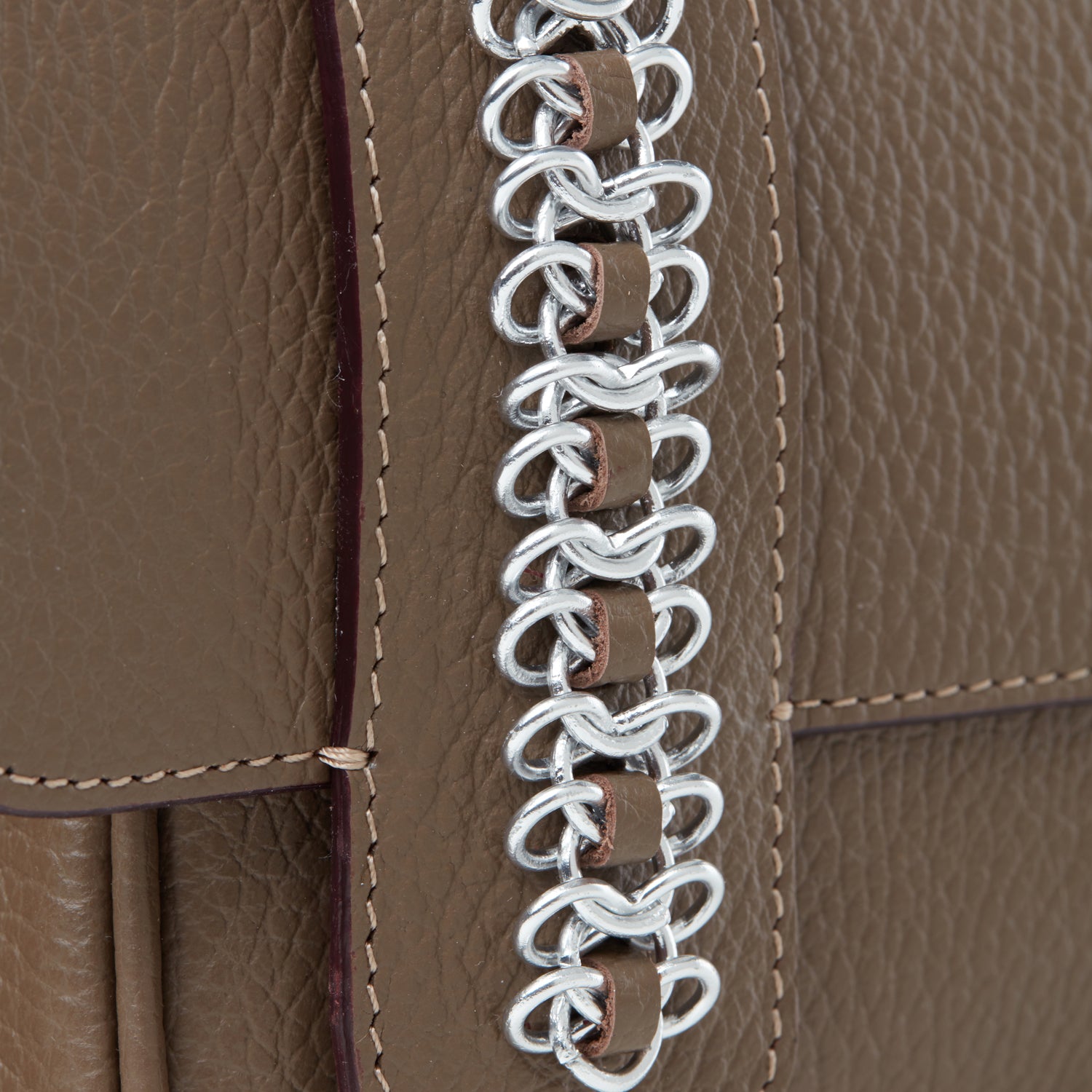 this is the waterproof signature chain's detail hand stitched designed by Alexandra Koumba